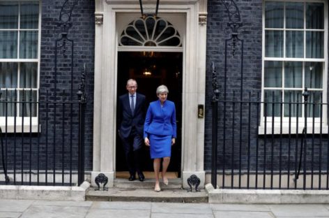 Tottering Theresa May names new UK Cabinet as critics circle