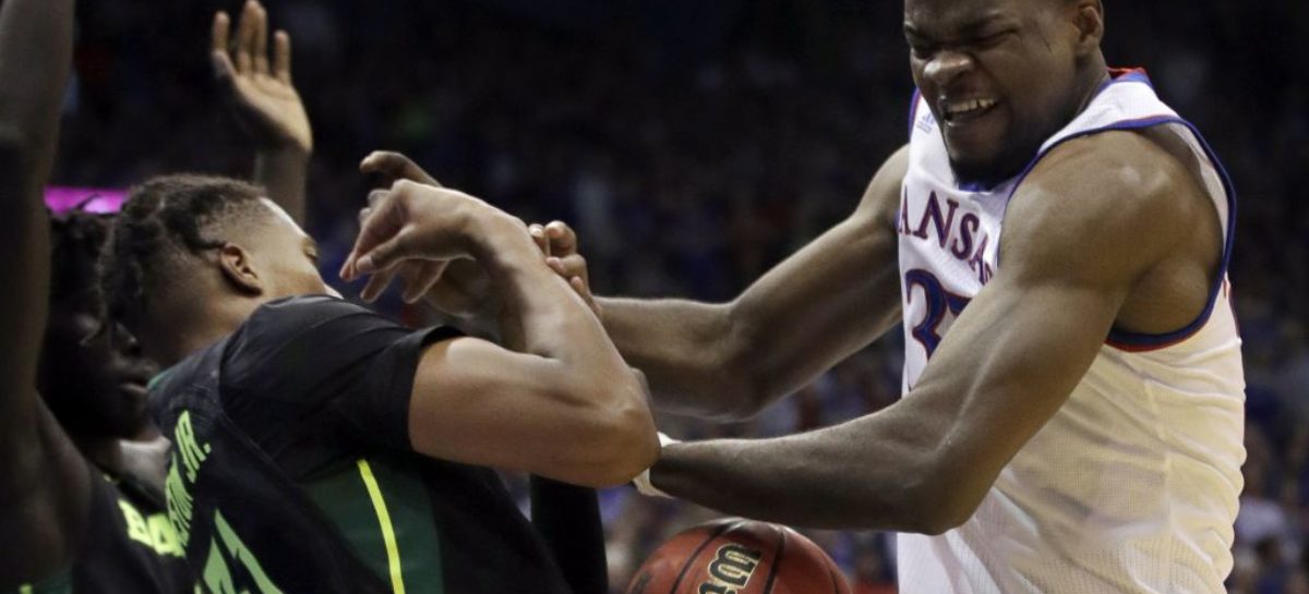 Kansas State guard Barry Brown Jr. exits with apparent eye injury